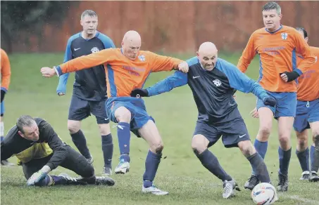  ??  ?? Doxy Lad (blue) threaten the Trimdon Vets goal last weekend. Picture by Tim Richardson.
