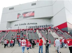  ?? CARLOS OSORIO/ AP PHOTO ?? Fans enter Joe Louis Arena for a Stanley Cup playoff game in Detroit. The Lions, Tigers and Red Wings have had little trouble drawing fans despite the economic downturn in Detroit.
