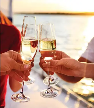  ??  ?? Delectable
Douro: Raising a toast, left, to a leisurely cruise along the Douro, far left, amid lush Portuguese vineyards