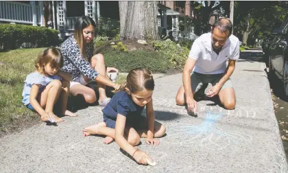  ?? PIERRE OBENDRAUF ?? Maya Angenot, husband Horia Bundaru, and their two daughters, five-year-old Éloïse, left, and seven-year-old Ariane, moved from an apartment in a noisy area of the Old Port to a home in N.D.G. five years ago. The kids make good use of the sidewalk in front of their home.