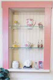  ??  ?? • A small sitting room just inside the front door is entered through what used to be an open porch, now a sunroom. The stone wall at left is the back of the living-room fireplace. The white built-in sideboard is original, but Sandy’s father added the...