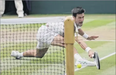  ?? Ben Curtis / Associated Press ?? Novak Djokovic returns the ball to Rafael Nadal during their semifinal at the Wimbledon Tennis Championsh­ips on Saturday. Djokovic advanced to a fifth Wimbledon final with a 6-4, 3-6, 7-6 (9), 3-6, 10-8 victory over Nadal. He’ll face Kevin Anderson in the final.