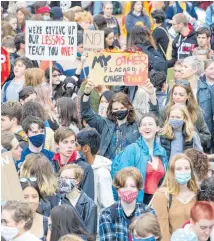  ?? PHOTOS / MARK MITCHELL ?? Students gather at Wellington’s Civic Square ahead of the Strike 4 Climate march to Parliament.