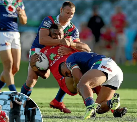  ?? GETTY IMAGES ?? Warriors standoff Blake Green wraps up Dragons centre Mikaele Ravalawa while, left, Eliesa Katoa goes over for a first-half try in Gosford.