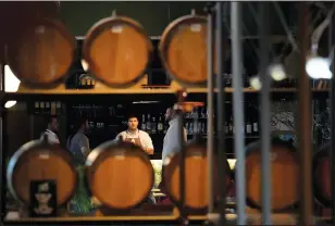  ?? ?? Barrels of brandy are shown at a bar in Belgrade.