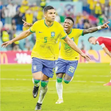  ?? Agence France-presse ?? Brazil’s Casemiro (centre) celebrates after scoring against Switzerlan­d during their Group G match on Monday.