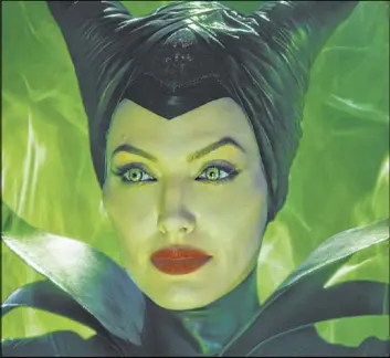  ??  ?? Angelina Jolie, above in “Maleficent,” reprises her role in “Maleficent : Mistress of Evil.”