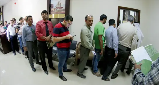  ?? Photos by M. Sajjad ?? After Sharjah Municipali­ty announced the doubling of residentia­l rent contract fees, queues such as these are being seen at leasing contract attestatio­n centres. Residents are racing against time to avoid paying the doubled fees. —