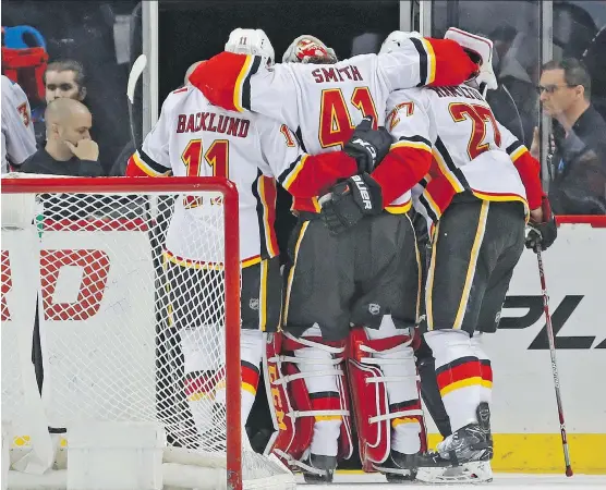  ?? KATHY WILLENS/AP ?? Flames goalie Mike Smith is day to day, but he won’t play Thursday after being helped off the ice during Sunday’s game against the New York Islanders.