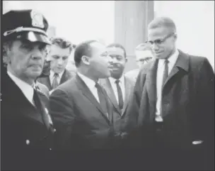  ??  ?? The Rev. Martin Luther King Jr. and Malcolm X meet at the U.S. Senate, on March 26, 1964, after a hearing on the 1964 Civil Rights Act.