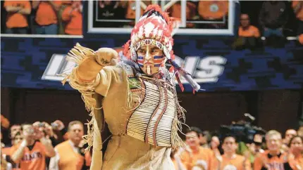  ?? (AP PHOTO/SETH PERLMAN, FILE) ?? FILE - In this Feb. 21, 2007 file photo, University of Illinois mascot Chief Illiniwek performs for the last time during an Illinois basketball game in Champaign, Ill. Illinois says the school is ending its tradition of playing “war chant” music during sporting events. Athletic department spokesman Kent Brown says the Illini made the decision in an effort to be more inclusive and because students haven’t responded to it as much at football games. The music stems from the school’s former mascot, Chief Illiniwek, a tradition that ended in 2007.