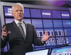  ?? BEN HIDER/GETTY IMAGES ?? Alex Trebek sent his congratula­tions to Maryanne Lewell and Michael Townes, calling them “winners in love.”