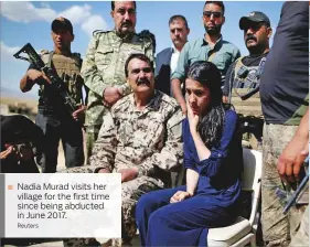  ?? Reuters ?? Nadia Murad visits her village for the first time since being abducted in June 2017.