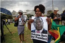  ?? AP ?? Supporters of Emmerson Mnangagwa await his arrival at Manyame airbase in Harare yesterday