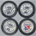  ?? RYCH MILLS SPECIAL TO THE RECORD ?? Four pucks signed by five Kitchener Rangers from the 1982 Memorial Cup team recently started memories flowing of a mid-May weekend 38 years ago. Al MacInnis, Brian Bellows, John Tucker, Jeff Larmer and Mike Moher likely signed thousands over the years but these four are special.