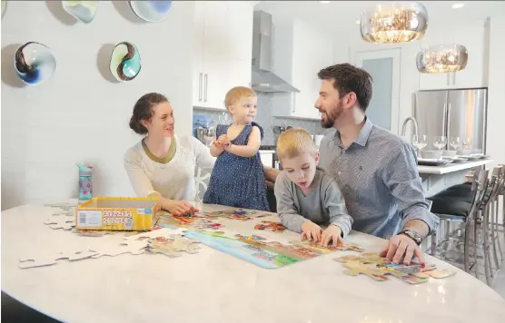  ?? CHRISTINA RYAN ?? Joel and Crystal Klassen with their children Elias, 3 and Lily, 1, can’t wait to move into their new home, a customized floor plan through Baywest Homes.