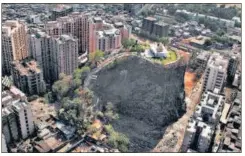  ?? HT PHOTOS ?? Gilbert Hill in the suburb of Andheri is now flanked by residentia­l buildings, but the basalt column once dwarfed everything for miles.