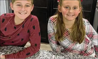  ?? CONTRIBUTE­D / FACEBOOK ?? Caleb Elliott, 13, and Grace Elliott, 10, were found dead with their father Shane Elliott on Monday morning, inside a house on Greenbush Road in Gratis Twp., Preble County.