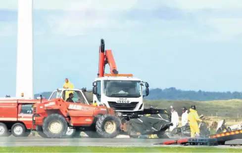  ??  ?? ● Main, the aftermath of the crash at Caernarfon airport in which experience­d pilot John Backhouse, right, died after reporting a fault with the pitch control of his Piper Navajo