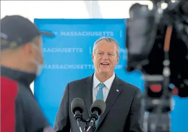  ?? NANCY LANE / BOSTON HERALD FILE ?? Gov. Charlie Baker, seen during a visit Wednesday to Moderna’s plant in Norwood, says he’ll update reopening plans next week. The move follows a revised CDC advisory that fully vaccinated people no longer need to wear masks in most circumstan­ces.