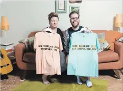  ?? MATHEW MCCARTHY WATERLOO REGION RECORD ?? Denise St Marie and Tim Walker show some of the T-shirts they make in their Kitchener apartment.