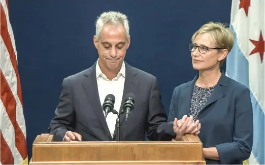  ?? SUN-TIMES FILE PHOTO ?? Mayor Rahm Emanuel, joined by his wife, Amy Rule, at his announceme­nt in September that he would not seek re-election.