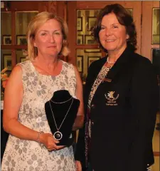  ??  ?? Winner of Division 2 on Lady Captain’s Day, Phil Rooney, is presented with her prize by Laytown & Bettystown Lady Captain Susan Clark.