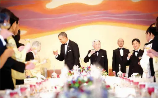  ??  ?? President Obama offered a toast to Empress Michiko and Emperor Akihito of Japan during a state dinner at the Imperial Palace. Credit Stephen Crowley/The New York Times