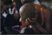  ?? KEVIN FRAYER — THE ASSOCIATED PRESS FILE ?? On June 12, 2012, a bonded child laborer rests his head in his hands after being rescued during a raid by workers from Bachpan Bachao Andolan, or Save Childhood Movement, at a garments factory in New Delhi, India.