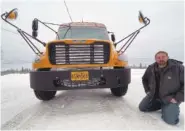  ?? AP PHOTO/MARK THIESSEN ?? Stretch Blackard, owner of Tok Transporta­tion, poses with an electric school bus Feb. 2 in Tok, Alaska.