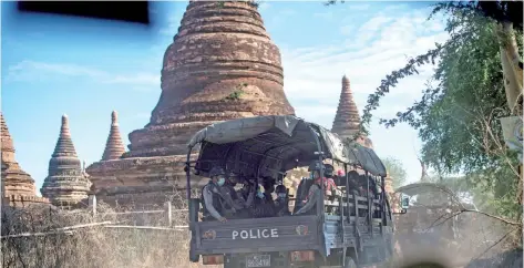  ?? — AFP photo ?? Members of a police squad on patrol in a temple complex in Bagan, Mandalay Region.