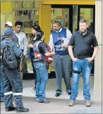  ?? Picture: WERNER HILLS ?? AT THE SCENE: Police take statements at the MTN store in Traduna Mall