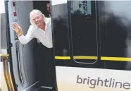  ?? Lynne Sladky, Associated Press file ?? Richard Branson, of Virgin Group, waves as he arrives on a Brightline train in West Palm Beach, Fla., in April.