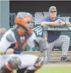  ?? AP PHOTO ?? GOOD SEAT, EH BUDDY? Manager John Farrell watches from the dugout during the Red Sox’ victory over the Orioles yesterday in Baltimore.