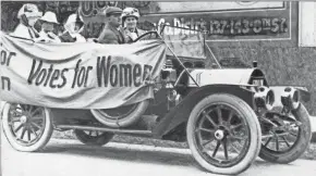  ?? WISCONSIN HISTORICAL SOCIETY ?? Members of the Political Equality League ride in an early Ford automobile draped with bunting reading “Votes for Women” in Milwaukee in this undated photo. In the front seat is Mrs. B.C. Gudden. In the back seat, left to right, are Ruth Fitch, Bertha Pratt King and Helen Mann.