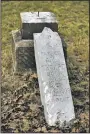 ?? File photo/Arkansas Democrat-Gazette/ MITCHELL PE MASILUN ?? A vandalized headstone at Thomas Cemetery is shown in 2016.