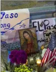  ?? ANDRES LEIGHTON - THE AP ?? In this Aug. 4 file photo, a Virgin Mary painting, flags and flowers adorn a makeshift memorial for the victims of the mass shooting at a Walmart in El Paso, Texas.