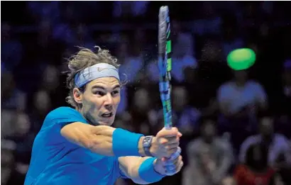  ?? AFP ?? Spain’s Rafael Nadal returns against Czech Republic’s Tomas Berdych in London. —