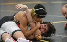  ??  ?? Chris Rocha of Riverside pins Perry’s Dominic Ciolli at 126pound during the Pirates’ 3635 win over the Beavers on Jan. 9.