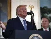  ?? JACQUELYN MARTIN — THE ASSOCIATED PRESS ?? President Donald Trump, accompanie­d by Secretary of State Mike Pompeo, speaks Wednesday in Washington.