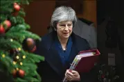  ?? LEON NEAL / GETTY IMAGES ?? British Prime Minister Theresa May won the vote of 317 Conservati­ve legislator­s with a 200-117 tally that reflected discontent within the party over her handling of Britain’s exit from the European Union.