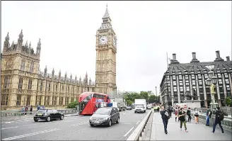  ?? (AFP) ?? A security barrier between the road and the pavement is pictured after being installed on Westminste­r Bridge in London on June 5, in reaction to the recent terror attacks. British police on Monday made several arrests in two dawn raids following the...