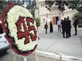  ?? MARCIO JOSE SANCHEZ/AP ?? A floral arrangemen­t with the jersey number for Angels pitcher Tyler Skaggs is shown outside of the St. Monica Catholic Church during a memorial in his honor Monday.