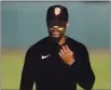  ?? NHAT V. MEYER — BAY AREA NEWS GROUP FILE ?? The San Francisco Giants’ Jaylin Davis prepares to put his mask on during warmups before their exhibition game against the Oakland Athletics at Oracle Park in San Francisco on July 21, 2020.