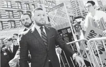  ?? NEW YORK DAILY NEWS FILE PHOTO ?? Conor McGregor, centre, arrives at Brooklyn Supreme Court in New York on June 14 in connection with his alleged April attack on a bus at Barclays Center. McGregor pled guilty to his role in the fight Thursday.