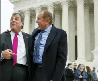  ?? JACQUELYN MARTIN — THE ASSOCIATED PRESS ?? New Jersey Gov. Chris Christie, left, and New Jersey State Sen. Raymond Lesniak, talk after a news conference at the Supreme Court where a case on sports betting is being heard, Monday.