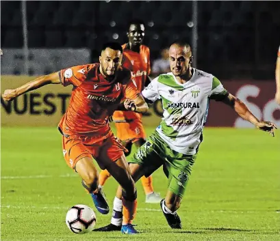  ?? COURTESY DIARIOS MODERNOS ?? Forge FC’s David Choinière, who has scored big CONCACAF league goals, dribbles the ball past an Antigua GFC player in 2019.