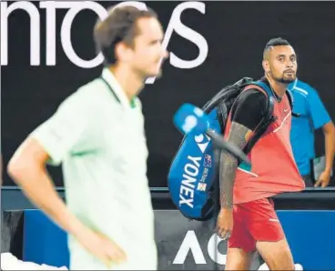  ?? AFP ?? Australia’s Nick Kyrgios (R) watches as Daniil Medvedev is interviewe­d on court after his victory in Melbourne on Thursday.