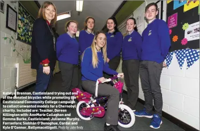  ?? Photo by: John Reidy ?? Katelyn Brennan, Castleisla­nd trying out one of the donated bicycles while promoting the Castleisla­nd Community College campaign to collect unwanted models for a Chernobyl charity. Included are: Teacher, Doreen Killington with: AnnMarie Callaghan and Gemma Burke, Castleisla­nd; Julianne Murphy, Farranfore; Siobhán O’Donoghue, Cordal and Kyle O’Connor, Ballymacel­ligott.