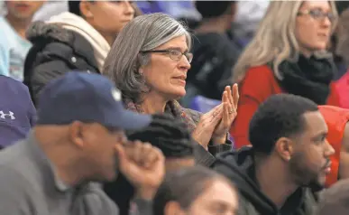  ?? PHOTOS BY TIMOTHY T. LUDWIG/USA TODAY SPORTS ?? Maura MacDonald watches her husband, Mike, coach basketball.